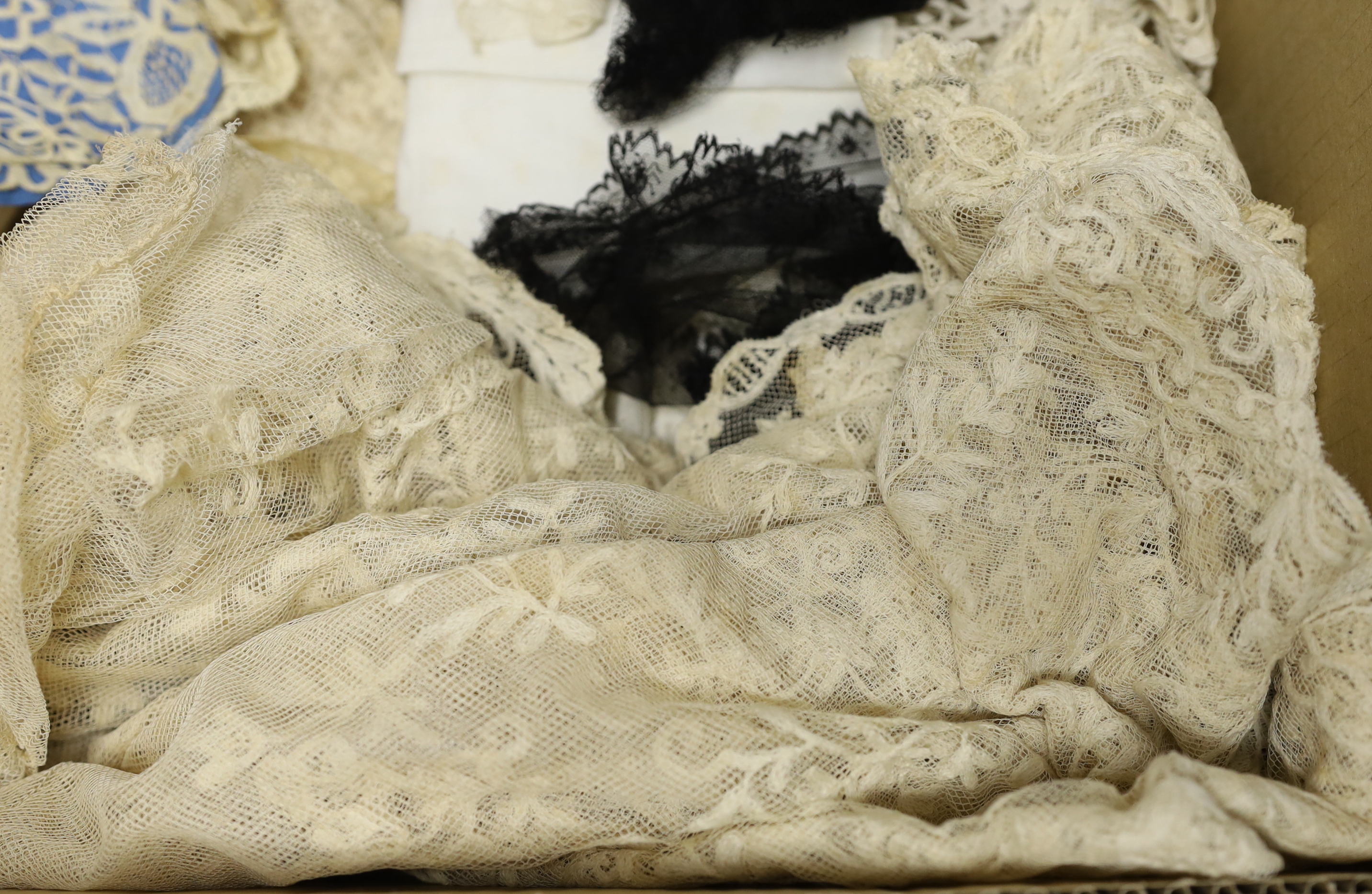 19th century mixed hand made and machine lace: a cream lace needle run bonnet veil, a similar stole and two lengths of wide trimming, together with other lace items and a quantity of black lace
